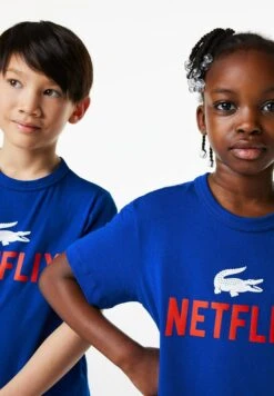 Lacoste X Netflix Unisex - T-Shirt Print - Bleu 8 Lacoste X Netflix Unisex - T-Shirt Print - Bleu -Lacoste 58f42202e1c4419c88414856ad4583ea