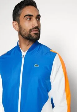 Lacoste Sport Tracksuit - Trainingspak - Kingdom/Flashy Orange-Flour -Lacoste 7d75c1413dbb478abd8b927cb152497d