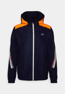 Lacoste Sport Tennis Jacket Tapered - Trainingsvest - Navy Blue/Flashy Orange Flourecend -Lacoste b607ea5628f64bb89fe30a24d3ca0563