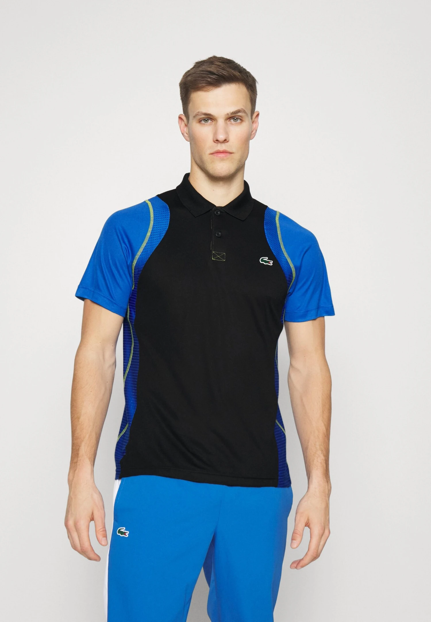Lacoste Sport Tennis Tour - Poloshirt - Noir/Bleu/Jaune 1 Lacoste Sport Tennis Tour - Poloshirt - Noir/Bleu/Jaune